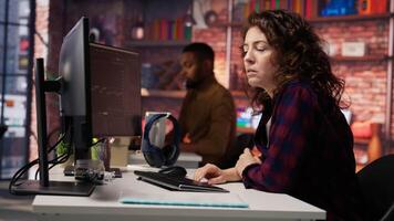 Startup manager delighted by successful IPO, watching live market updates showing stocks raising. Venture team leader happy after becoming publicly traded company, giving good news to team, camera B video