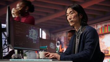 CTO manager in AI startup drinking coffee while coding applications in programming languages. Chief technician officer enjoying hot beverage while doing code testing and quality assurance, camera B video