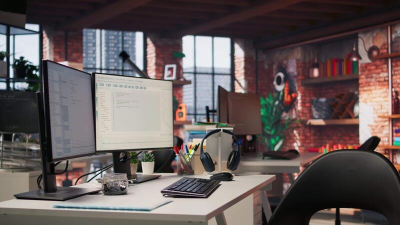 PC display on startup office desk showing programming languages written ...
