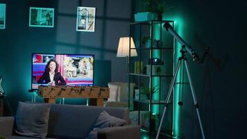 Cozy high end apartment illuminated with neon lights and a big tv, home theatre and setup for a young adult. Empty loft decorated and equipped with electronics, comfortable space. video