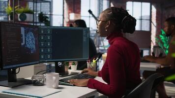 Software engineer solving tasks with AI LLM chatbot answering prompts using predictive technology. Startup staff member using computer to interact with generative large language model app, camera A video