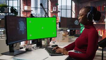 Isolated screen PC in workspace used by AI researcher working with artificial intelligence technology. Mockup computer monitor used by employee developing AI systems in tech startup, camera A video