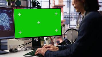 AI startup office chief technology officer building application on isolated screen computer. Senior developer working in artificial intelligence software development agency on mockup PC, camera B video