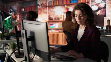 Portrait of upbeat programmer coding advanced AI algorithm in startup, refining machine learning models to enhance automation. Cheerful woman using coding platform in Silicon Valley office, camera A video