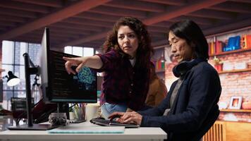 AI startup engineer asks questions to team leader before starting implementing machine learning. Artificial intelligence tech venture employee requests help from manager to fix code bugs, camera B video