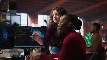 Teamworking engineers coding advanced AI algorithm and machine learning models enhancing automation. Employee talking with coworker in artificial intelligence Silicon Valley workspace, camera A video