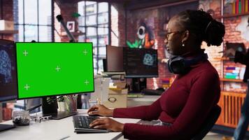 Isolated screen PC in workspace used by AI researcher working with artificial intelligence technology. Mockup computer monitor used by employee developing AI systems in tech startup, camera B video