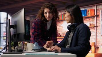 Coworkers collaborating in AI tech agency providing software development services. Teamworking startup office colleagues using artificial intelligence to streamline coding process, camera B video
