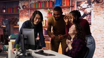 Overjoyed multiethnic startup team celebrating high valuation on stock exchange, raising money. Happy tech business entrepreneurs securing angel investments, becoming unicorn company, camera B video