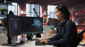 CTO manager in AI focused startup designing, coding and debugging applications in different software languages. Chief technician officer doing code testing and quality assurance, camera A video