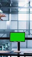 Vertical Data center team using mockup green screen tablet, reviewing paperwork files, and security protocols. Server room admins next to chroma key device analyzing critical system reports, camera A video