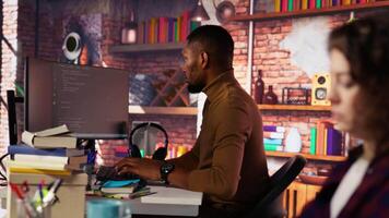 AI startup programmer testing company software to minimize occurrence of bugs, identifying bottlenecks. Man writing clean, efficient code in programming language to reduce errors, camera B video