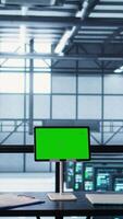 Vertical Data center team using mockup green screen tablet, reviewing paperwork files, and security protocols. Server room admins next to chroma key device analyzing critical system reports, camera B video