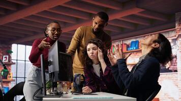 Startup team in office disappointed after watching stock exchange valuation decline because of market volatility. Upset venture workers analyzing charts, seeing stock valuation drop, camera B video