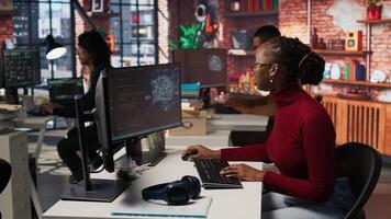 Programmer coding artificial intelligence algorithm in startup, refining machine learning models to enhance automation and data driven decision making. Woman using coding platform in office, camera A video