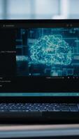 Vertical Focus on laptop used by teamworking data center computer scientists in background using artificial intelligence. Notebook screen with neural networks doing computing processes, camera A close up video
