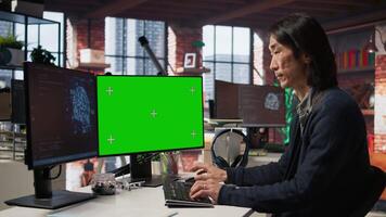 AI startup office chief technology officer building application on isolated screen computer. Senior developer working in artificial intelligence software development agency on mockup PC, camera A video