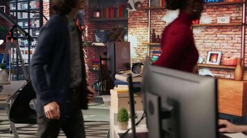 Irked man punching startup office desk in frustration struggling to fix application errors. Upset programmer annoyed by computer bugs while coding in software development agency, camera A video