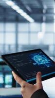 Vertical Engineer in data center with tablet integrating AI driven automation tools. Worker ensuring continuous uptime of server room using artificial intelligence, managing data flows, camera B video