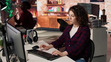 CTO manager overseeing work done by engineer in tech agency providing software development services. Startup office supervisor checking up on IT expert using artificial intelligence, camera A video