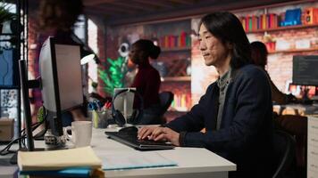 AI startup office admin asks questions to senior team leader before starting implementing machine learning. Tech venture company worker requests help from manager to fix code bugs, camera A video
