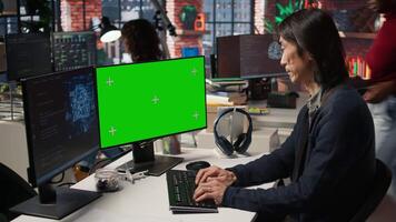 Chief technical officer uses mockup PC in AI tech company providing software development services. Startup IT expert uses AI to streamline coding process on green screen PC, camera A video