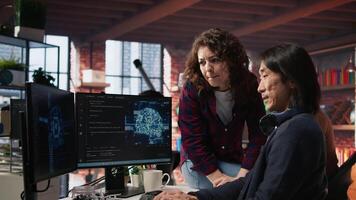 AI startup engineer asks questions to team leader before starting implementing machine learning. Artificial intelligence tech venture employee requests help from manager to fix code bugs, camera A video