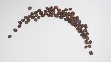 Top View of Half Circle of Coffee Beans on White Background photo