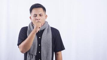 Young Asian Man Cough into His Hand on White Background photo