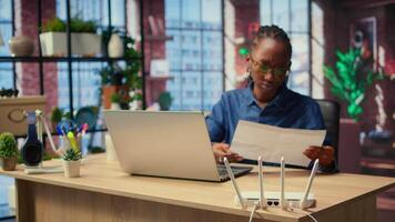 Irritated African American girl struggling to reach the internet provider to help fix the signal loss issues, freelancer working at home with an unstable Wi Fi connection. Camera A. video
