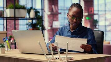 Irritated African American girl struggling to reach the internet provider to help fix the signal loss issues, freelancer working at home with an unstable Wi Fi connection. Camera B. video