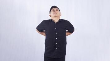 Asian Young Man with Back Pain on White Background photo