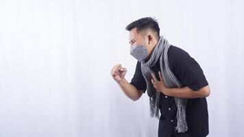 Side View of Young Asian Man with Acute Cough on White Background photo