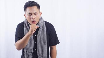 Young Asian Man Coughing on White Background photo