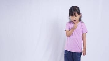 Asian Little Girl Coughing on White Background photo
