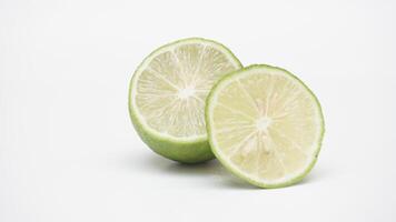 Half of Fresh Green Lime on White Background photo