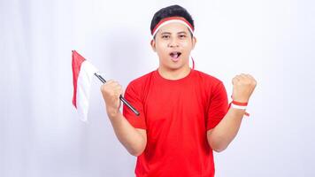 Indonesian Man with Red and White Ribbons Showing Yes Gesture Celebrate Independence Day of Indonesia on White Background photo