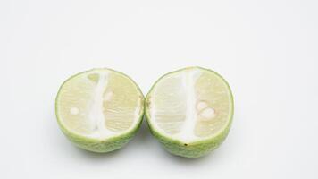 Half of Fresh Green Lime Fruit on White Background photo
