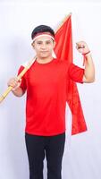 Indonesian Man with Red and White Attribute and Flag on White Background photo