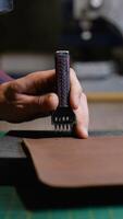 Leatherworker Using Stitching Punch Tool and Mallet video