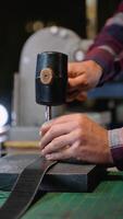 Tailor Working on a Leather Belt in a Well-Equipped Workshop video