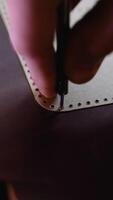 Close-Up of Leather Marking with a Template and Awl video