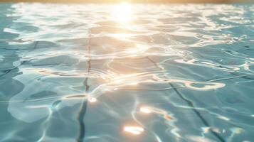 Sunlight reflecting on tranquil water surface in a serene pool setting at sunset photo
