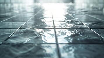 Water pooling on tiled floor in a serene indoor space, reflecting light and creating tranquility photo