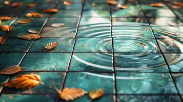Tranquil water ripple on tiled surface surrounded by autumn leaves in serene environment photo