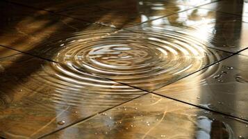 Close-up of rippling water on a glossy tiled floor reflecting warm sunlight in a serene indoor setting photo