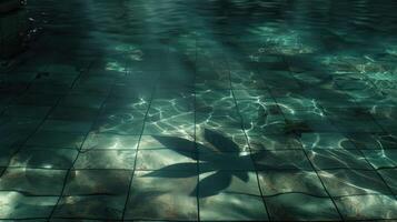 Tranquil underwater scene showcasing tiled pool floor with gentle reflections and shadows photo