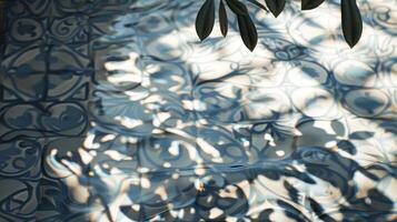 Reflection of intricate tile patterns in water with soft light filtering through leaves photo