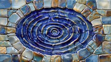 Close-up of a vibrant mosaic design featuring blue ripples in a stone pattern, ideal for art projects photo