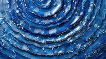 Close-up of blue water ripples with bubbles creating a serene aquatic pattern, ideal for backgrounds photo
